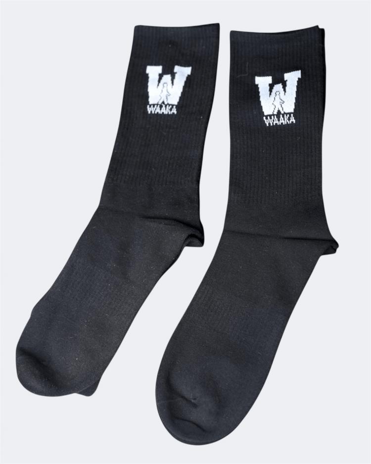 Black sock with WAAKA logo and text on a white background displayed