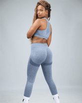 Person wearing a blue athletic outfit on a plain background