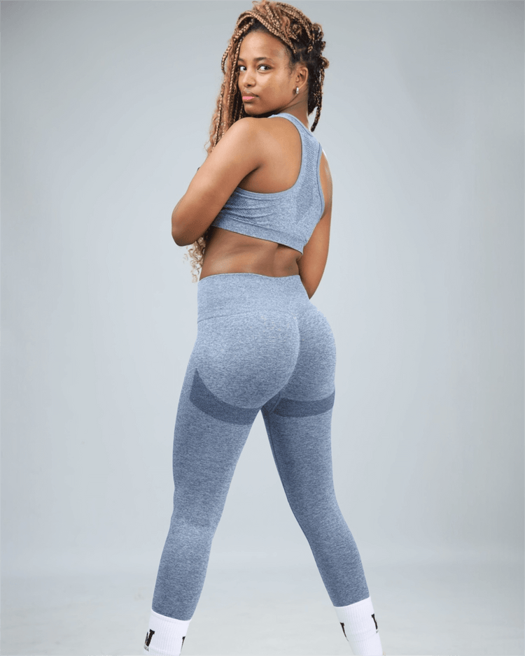 Person wearing a blue athletic outfit on a plain background