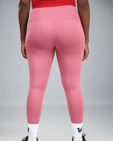 mauve Pink leggings with a logo on a grey background showing back view