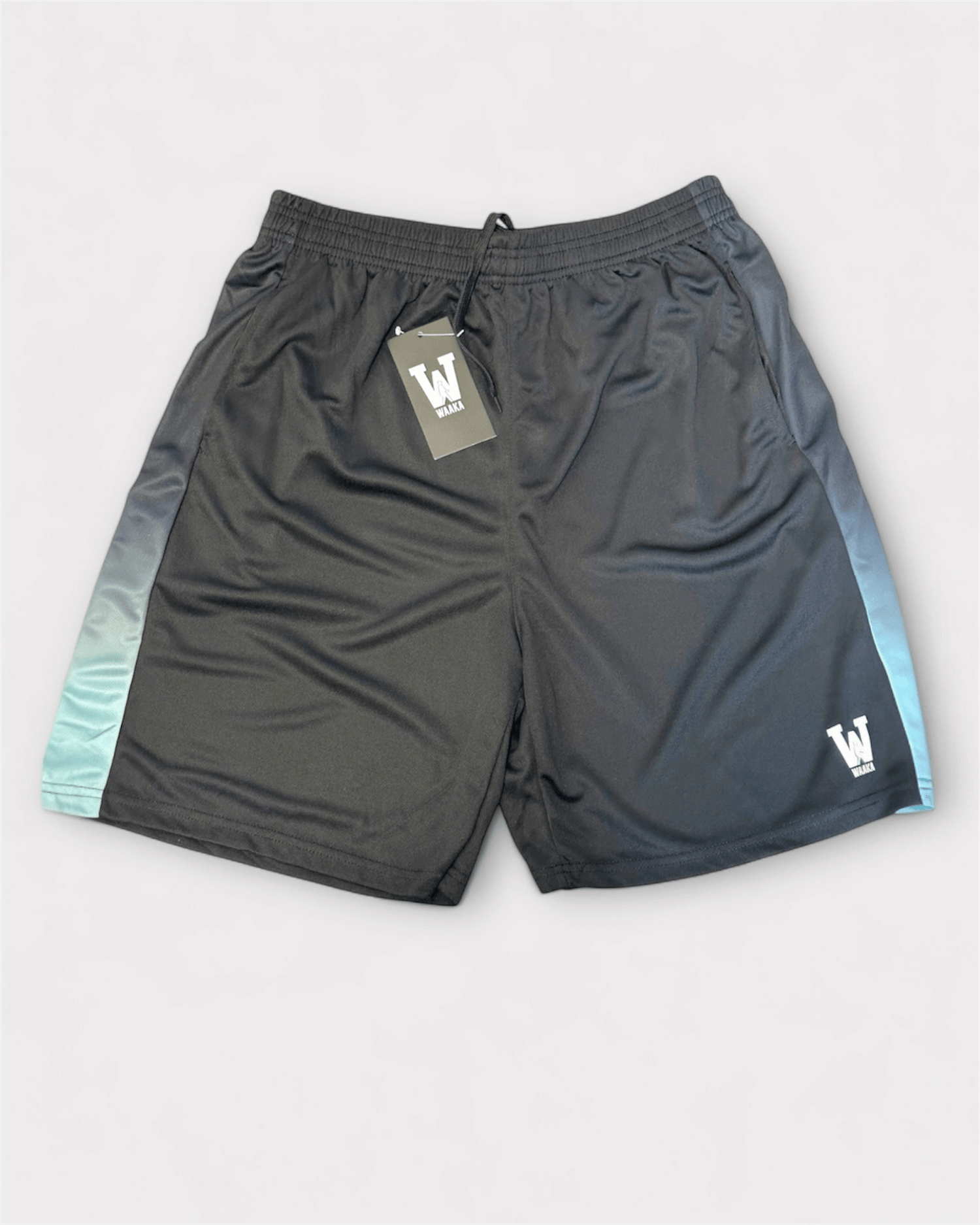 Eco black with blue accent shorts with a waaka brand logo on a light gray background