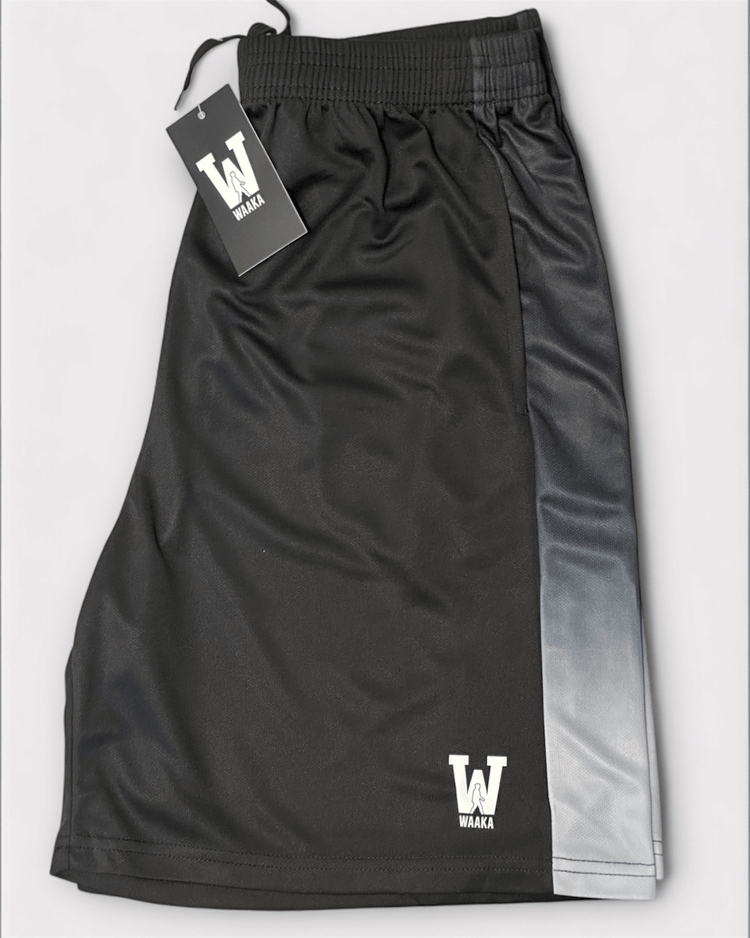 Black and grey accent athletic shorts with waaka logo on a white background