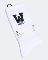 White socks with black waaka logo and text on a white background