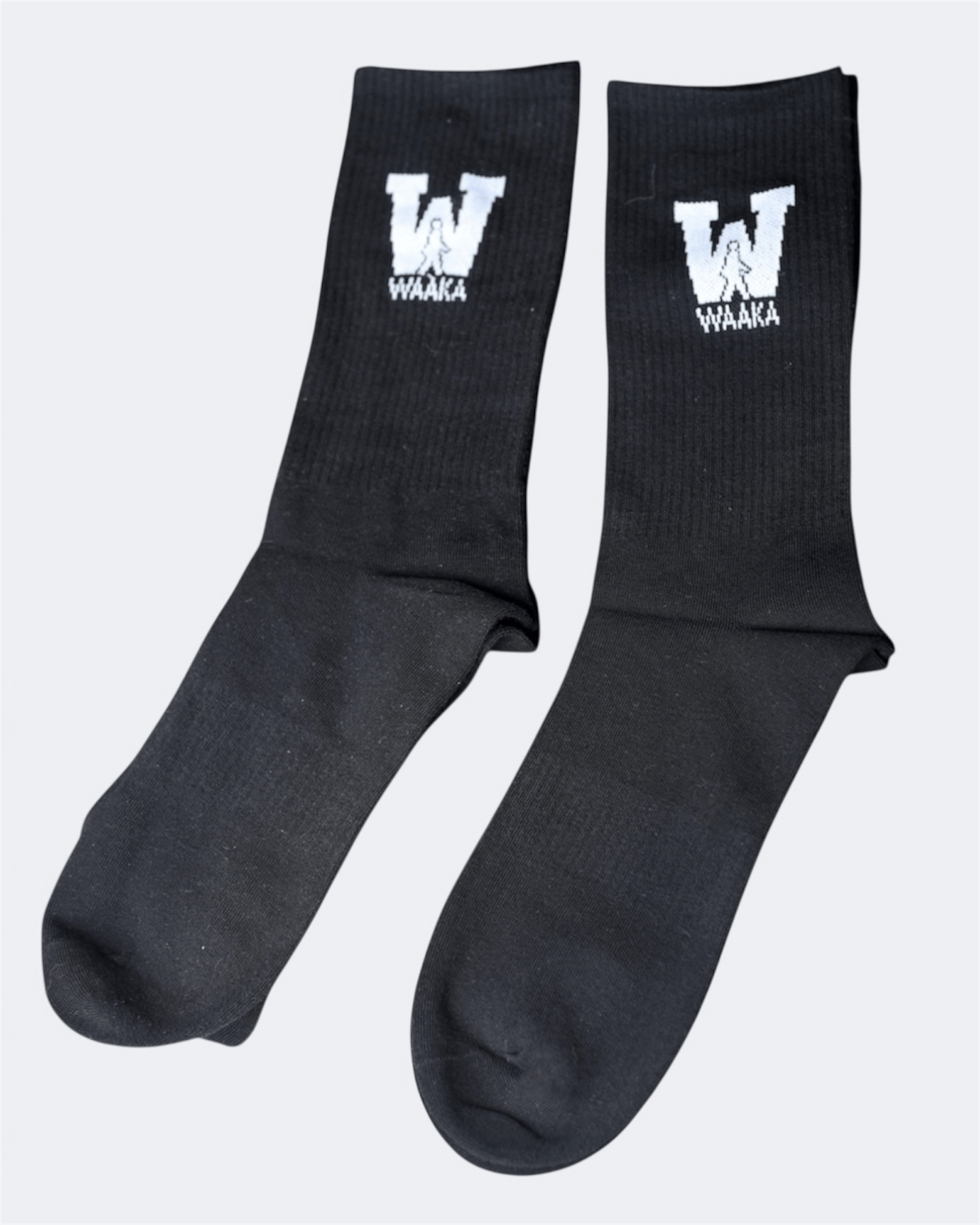 Black sock with WAAKA logo and text on a white background displayed