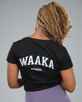 Person wearing a black &