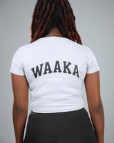 Person wearing a light grey t-shirt with &