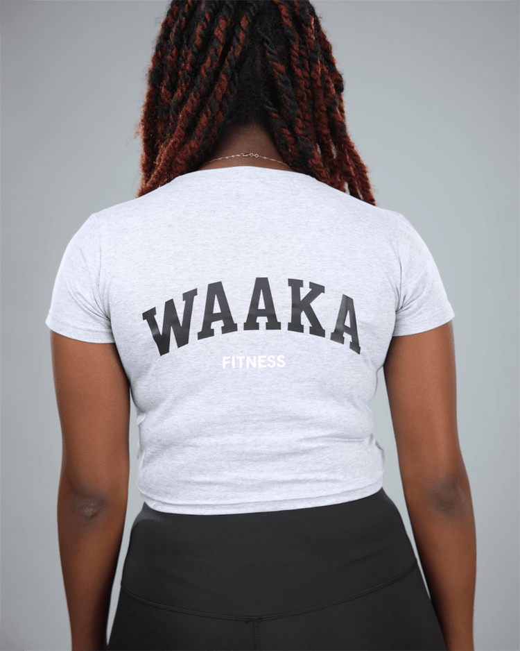 Person wearing a light grey t-shirt with &