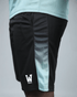 Black eco training shorts with a light blue stripe featuring waaka logo on a grey background