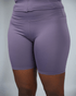 Purple athletic shorts on a plain background